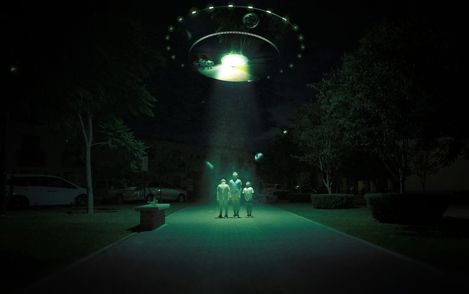 a group of people standing in front of a lighted archway